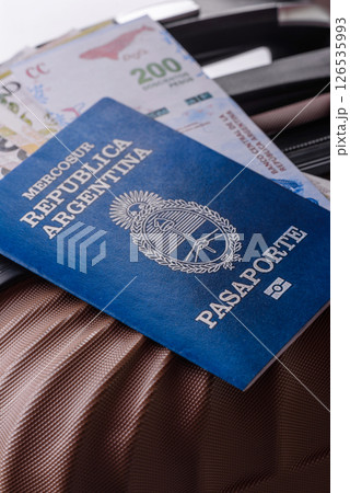 International passport of a citizen of Argentina on a suitcase 126535993