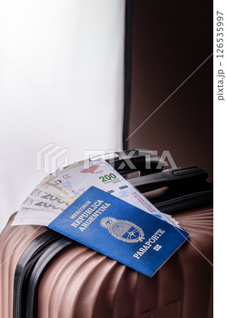 International passport of a citizen of Argentina on a suitcase 126535997