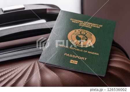 International passport of a citizen of Nigeria on a suitcase 126536002