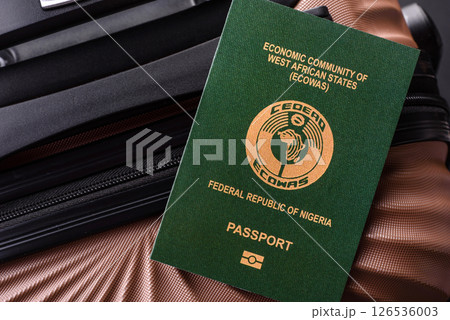 International passport of a citizen of Nigeria on a suitcase 126536003