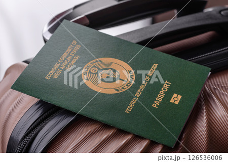 International passport of a citizen of Nigeria on a suitcase 126536006