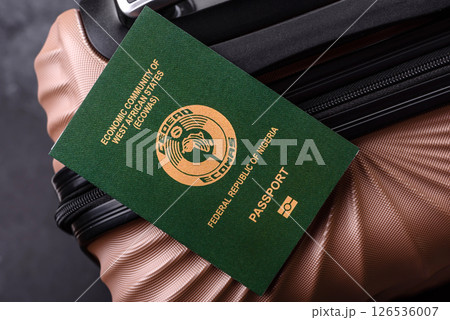 International passport of a citizen of Nigeria on a suitcase 126536007