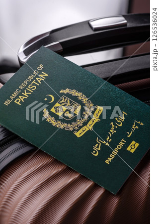 International passport of a citizen of Pakistan on a suitcase International passport of a citizen of Pakistan on a suitcase 126536024
