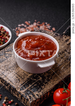 Red sauce or ketchup with salt and spices in ceramic sauce boat Red sauce or ketchup with salt and spices in ceramic sauce boat 126536093