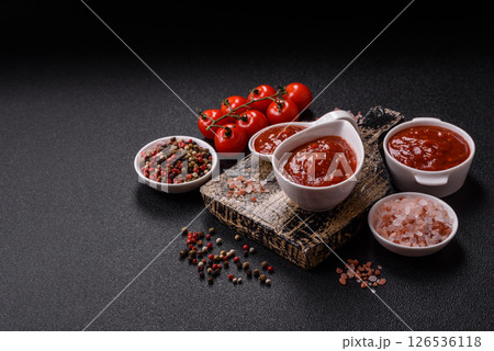 Red sauce or ketchup with salt and spices in ceramic sauce boat Red sauce or ketchup with salt and spices in ceramic sauce boat 126536118