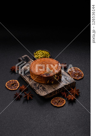 Round puff pastry croissant with pistachio filling or new york roll 126536144