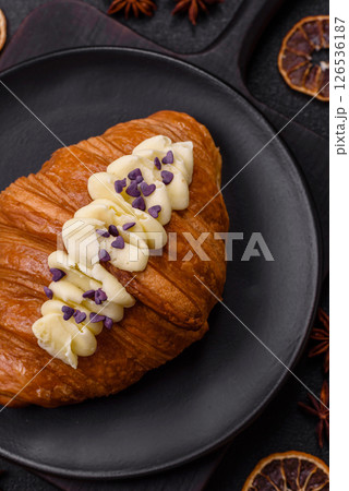 Sweet crispy fresh croissant with berry filling 126536187