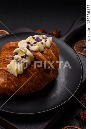 Sweet crispy fresh croissant with berry filling 126536188