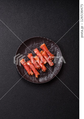 Cheese and meat, jamon or prosciutto rolled into a roll 126536475