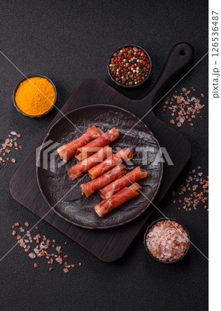 Cheese and meat, jamon or prosciutto rolled into a roll Cheese and meat, jamon or prosciutto rolled into a roll 126536487