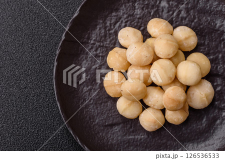 Raw peeled macadamia nut in ceramic bowl Raw peeled macadamia nut in ceramic bowl 126536533