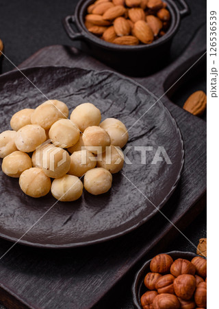 Raw peeled macadamia nut in ceramic bowl Raw peeled macadamia nut in ceramic bowl 126536539