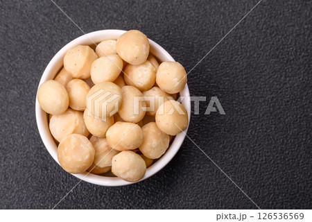 Raw peeled macadamia nut in ceramic bowl Raw peeled macadamia nut in ceramic bowl 126536569