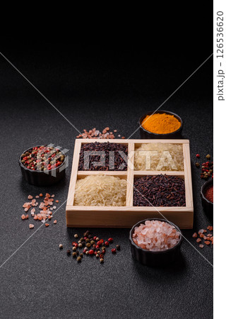 White and red raw rice grains in a ceramic bowl. Rice as an ingredient 126536620