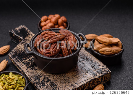 Nut, pecans in a ceramic bowl, an ingredient in vegan food 126536645