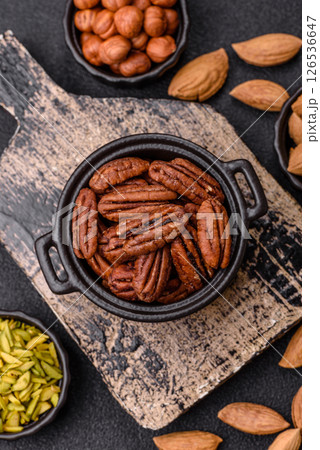 Nut, pecans in a ceramic bowl, an ingredient in vegan food Nut, pecans in a ceramic bowl, an ingredient in vegan food 126536647