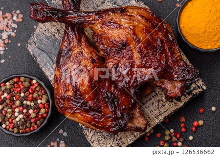 Duck, chicken leg or thigh grilled on a dark concrete background Duck, chicken leg or thigh grilled on a dark concrete background 126536662