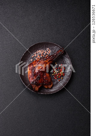 Duck, chicken leg or thigh grilled on a dark concrete background 126536671