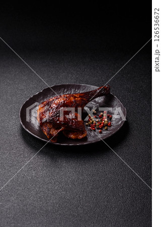 Duck, chicken leg or thigh grilled on a dark concrete background Duck, chicken leg or thigh grilled on a dark concrete background 126536672