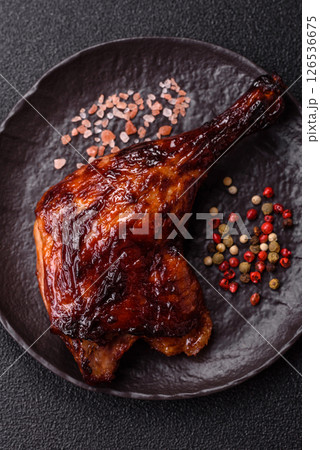 Duck, chicken leg or thigh grilled on a dark concrete background 126536675