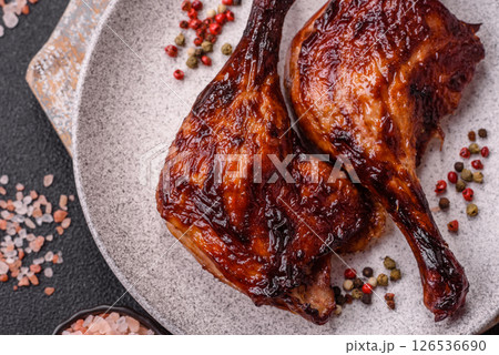 Duck, chicken leg or thigh grilled on a dark concrete background Duck, chicken leg or thigh grilled on a dark concrete background 126536690