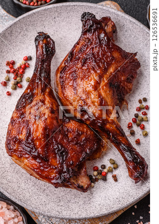Duck, chicken leg or thigh grilled on a dark concrete background 126536691
