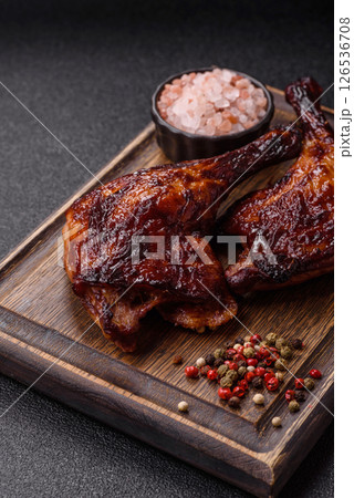 Duck, chicken leg or thigh grilled on a dark concrete background 126536708