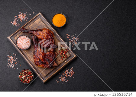 Duck, chicken leg or thigh grilled on a dark concrete background Duck, chicken leg or thigh grilled on a dark concrete background 126536714
