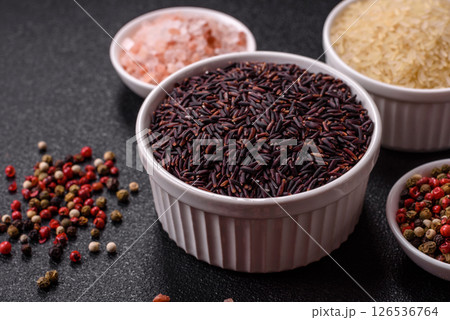 Red or brown raw rice in a ceramic bowl Red or brown raw rice in a ceramic bowl 126536764