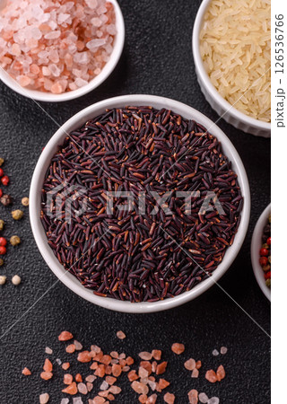 Red or brown raw rice in a ceramic bowl 126536766
