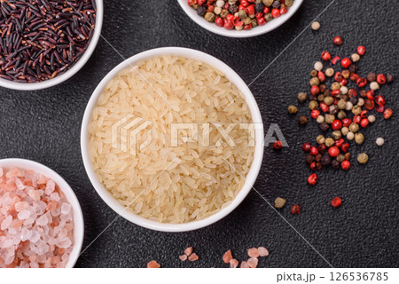White raw rice in a ceramic bowl. Rice as an ingredient 126536785