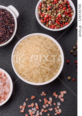 White raw rice in a ceramic bowl. Rice as an ingredient 126536786