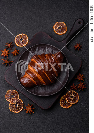 Sweet fresh crispy croissant with chocolate filling 126536839