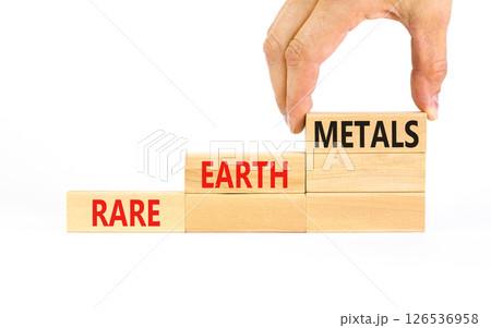 Rare earth metals symbol. Concept words Rare earth metals on beautiful wooden block. Businessman's hand. Beautiful white background. Business and rare earth metals concept. Copy space. Rare earth metals symbol. Concept words Rare earth metals on beautiful wooden block. Businessman's hand. Beautiful white background. Business and rare earth metals concept. Copy space. 126536958