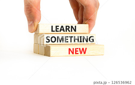 Learn something new symbol. Concept words Learn something new on beautiful block. Businessman's hand. Beautiful white background Business motivational lifestyle learn something new concept Copy space 126536962