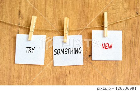 Try something new symbol. Concept words Try something new on beautiful white paper on wooden clothespin. Beautiful wooden background. Business motivational try something new concept. Copy space Try something new symbol. Concept words Try something new on beautiful white paper on wooden clothespin. Beautiful wooden background. Business motivational try something new concept. Copy space 126536991