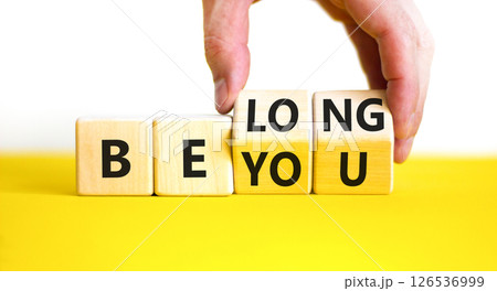 Belonging and belong symbol. Concept words Be you Belong on beautiful wooden block. Beautiful white background Businessman hand. Business motivational belonging and belong concept. Copy space. 126536999