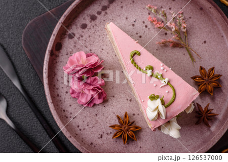 A piece of pink layered cake with strawberry flavor A piece of pink layered cake with strawberry flavor 126537000