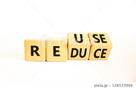 Reuse or reduce symbol. Concept words Reuse Reduce on wooden block. Beautiful white table white background. Business reuse or reduce concept. Copy space. 126537004