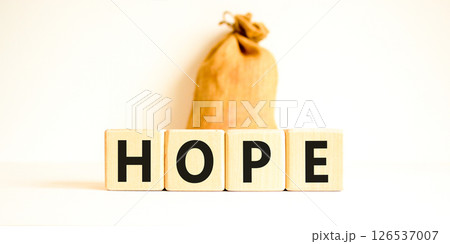 Hope symbol. Concept word Hope on beautiful wooden blocks. Beautiful canvas bag. Beautiful white table white background. Business, lifestyle, support and hope concept. Copy space. 126537007