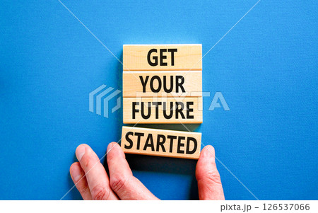 Get your future started symbol. Concept words Get your future started on beautiful wooden blocks. Businessman hand. Beautiful blue background. Business get your future started concept. Copy space. Get your future started symbol. Concept words Get your future started on beautiful wooden blocks. Businessman hand. Beautiful blue background. Business get your future started concept. Copy space. 126537066