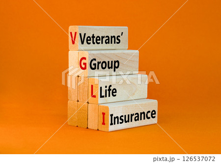 VGLI Veterans Group Life Insurance symbol. Concept word VGLI Veterans Group Life Insurance on blocks. Beautiful orange background. Business VGLI Veterans Group Life Insurance concept. Copy space. 126537072