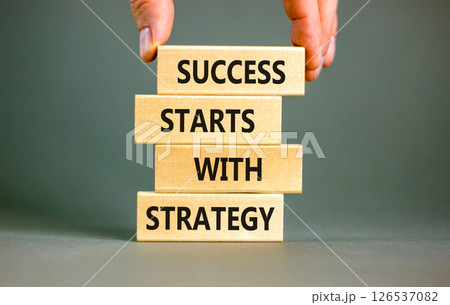 Success starts with strategy symbol. Concept words Success starts with strategy on beautiful wooden blocks. Beautiful grey background. Business and success starts with strategy concept. Copy space. Success starts with strategy symbol. Concept words Success starts with strategy on beautiful wooden blocks. Beautiful grey background. Business and success starts with strategy concept. Copy space. 126537082