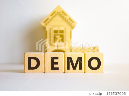 Demo symbol. Concept word Demo on beautiful wooden blocks. Beautiful white table white background. Wooden beautiful house. Business and demo concept. Copy space. 126537096