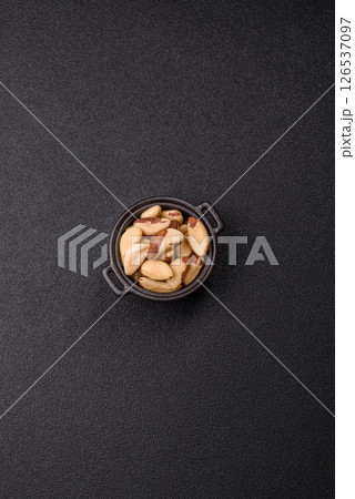 Brazil nut kernels in ceramic bowl 126537097