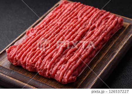 Raw ground beef or pork with salt and spices 126537227