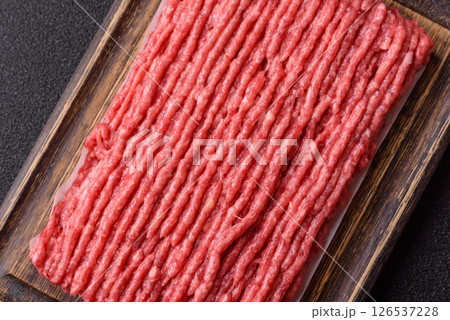 Raw ground beef or pork with salt and spices Raw ground beef or pork with salt and spices 126537228