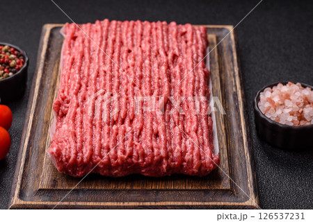 Raw ground beef or pork with salt and spices Raw ground beef or pork with salt and spices 126537231
