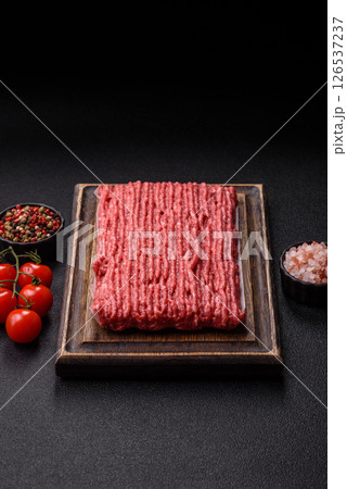 Raw ground beef or pork with salt and spices Raw ground beef or pork with salt and spices 126537237