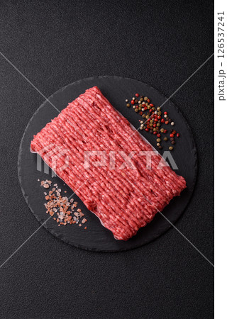 Raw ground beef or pork with salt and spices Raw ground beef or pork with salt and spices 126537241